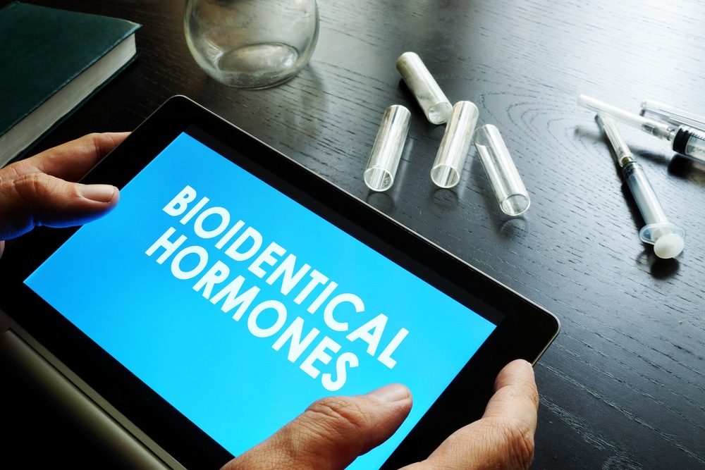 Bioidentical,Hormones.,Doctor,Holding,Tablet,With,Sign.