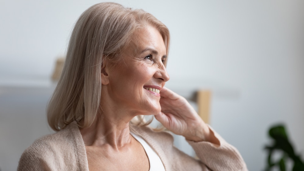 Happy and vibrant older woman who feels great with balanced hormones.