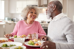 Healthy aging couple having dinner together