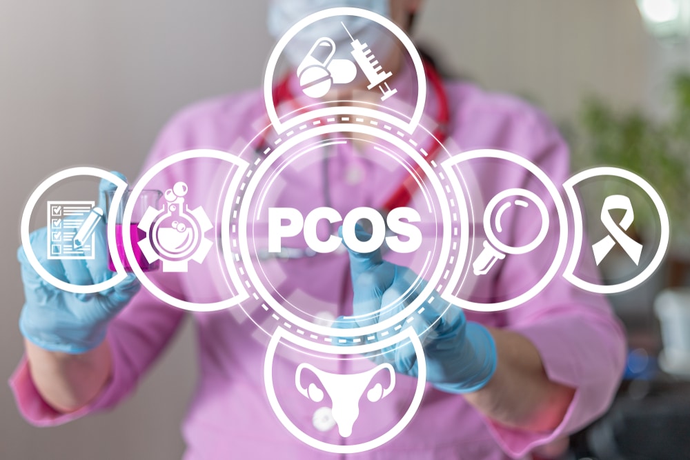 A medical graphic that says "PCOS" with a healthcare provider in the background