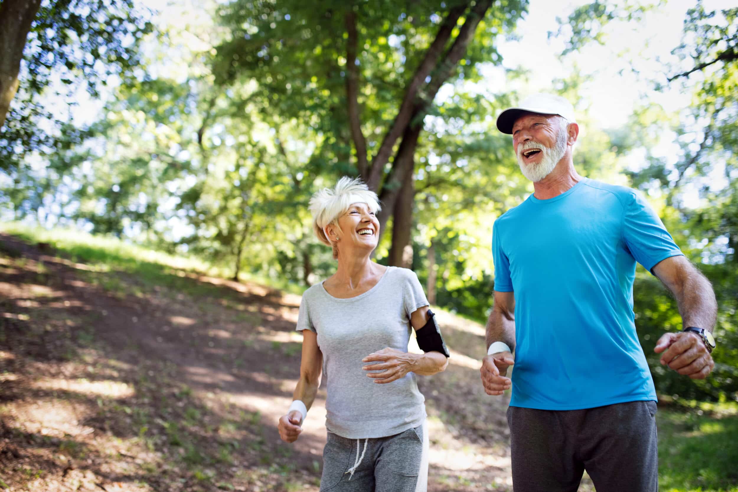 Older couple jogging outdoors, representing active aging, metabolic wellness, and weight management support with Pellecome FIT.
