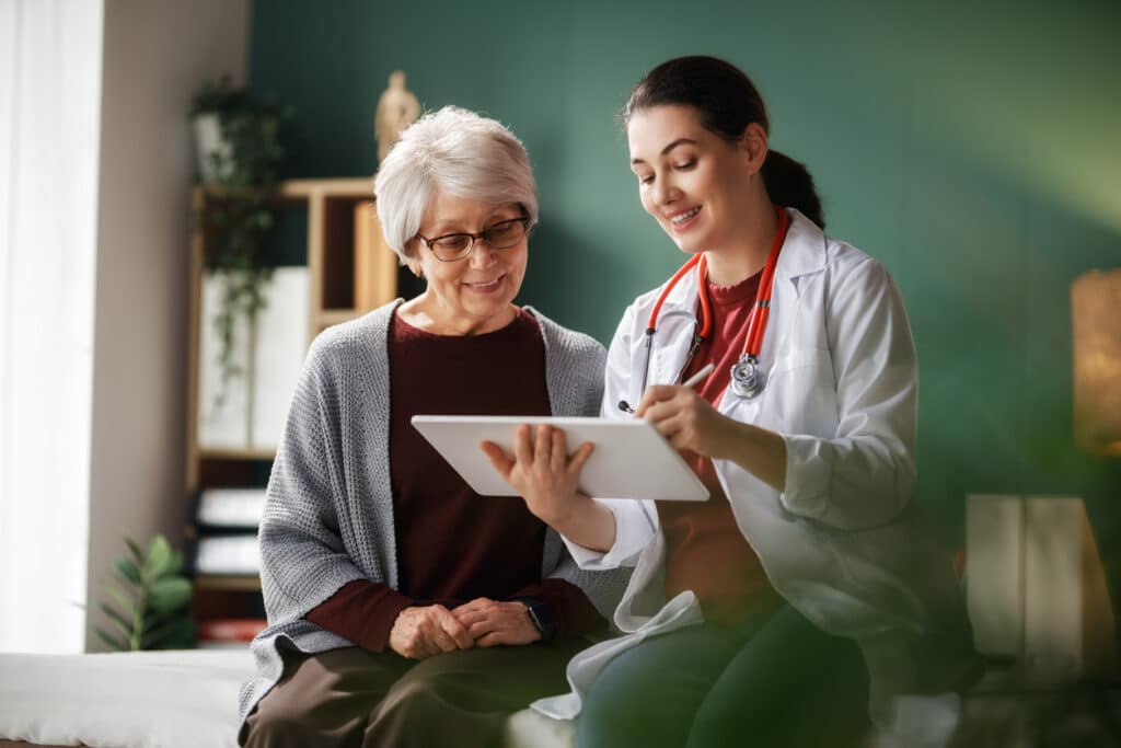 Healthcare provider reviewing follow-up care with a patient, representing hormone level reassessment and ongoing BHRT monitoring.