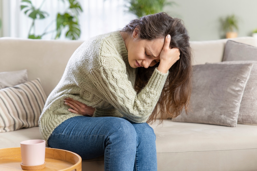 Woman experiencing stress-related fatigue linked to hormone imbalance
