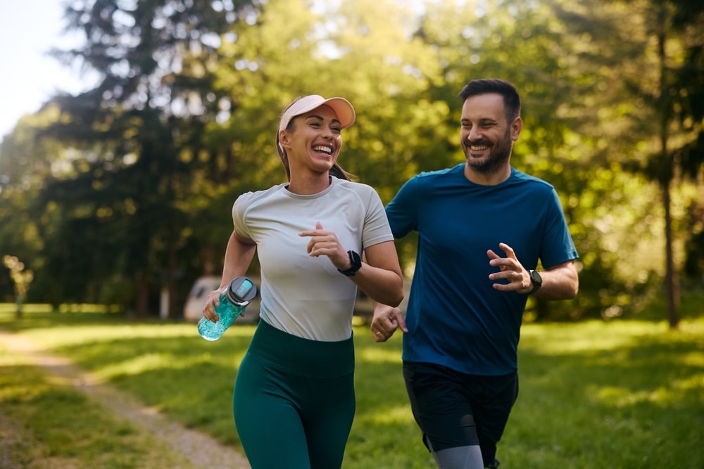 Couple jogging to support healthy aging, wellness, and metabolic health through an active lifestyle