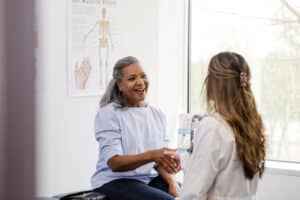 Patient discussing age-related changes and possible hormone imbalance with a healthcare provider.