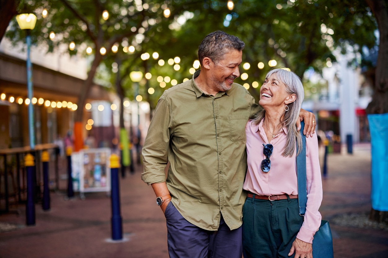 Older couple walking together, representing healthy aging and hormone wellness with pellet BHRT.